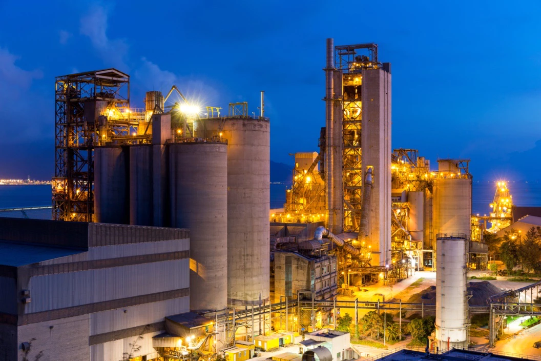 Industrial cement plant at dusk